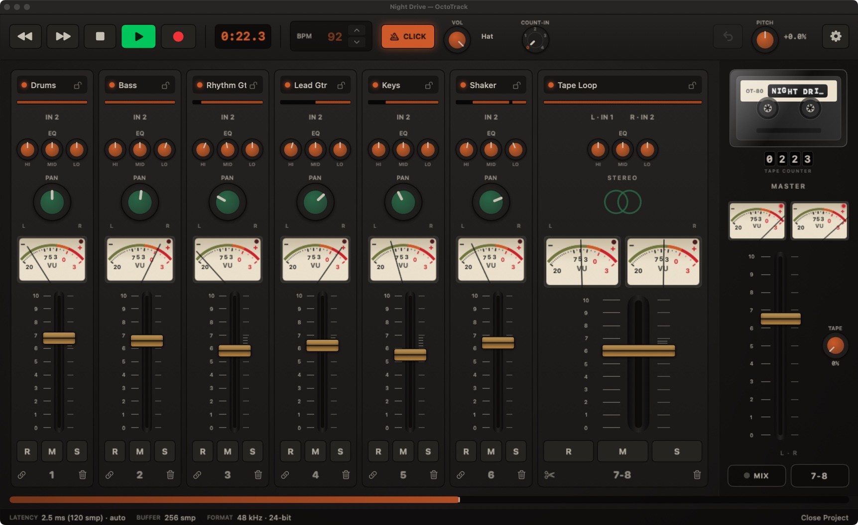 OctoTrack Studio main window: eight channel strips with VU needles moving, amber EQ knobs, a wide stereo pair on tracks 7-8, cassette reels turning and the transport rolling at 0:22.